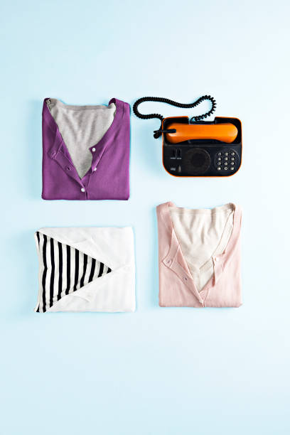 istock Fashionable sweaters isolated on blue background( 1389280994