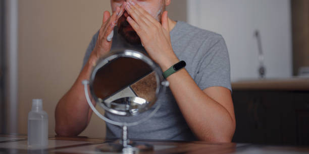 istock Men's beauty concept. caucAsian guy checking his skin. 1389282009