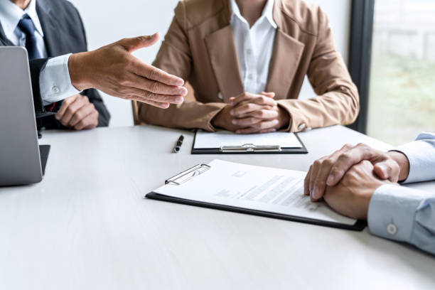 istock Business man explaining about his profile to two selection committee manager sitting in during job Interview, interview the job and hiring 1389283611