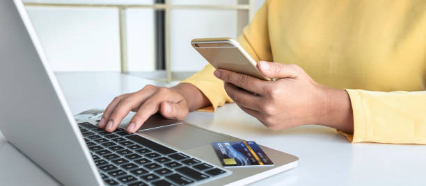 istock Woman using credit card and smartphone register security code payments online shopping and customer service network connection market, using technology on laptop, Internet Online shopping concept 1389283691