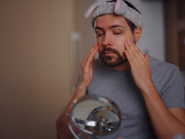 istock Men's beauty concept. caucAsian guy checking his skin. 1389283818