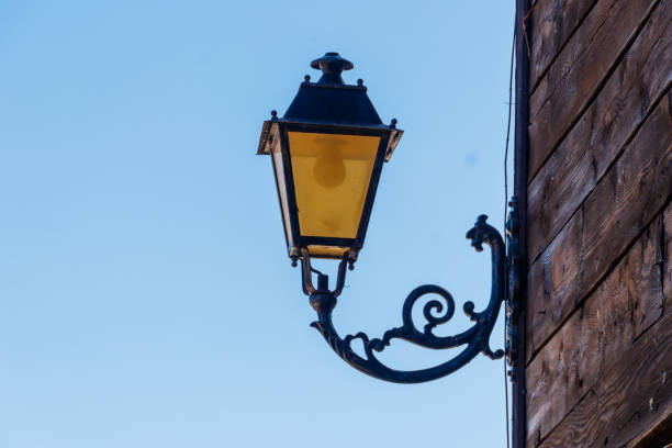 istock Vintage iron lantern on a house wall 1389283988