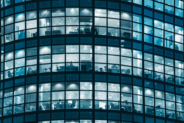 istock Facade of modern building at night 1389285241