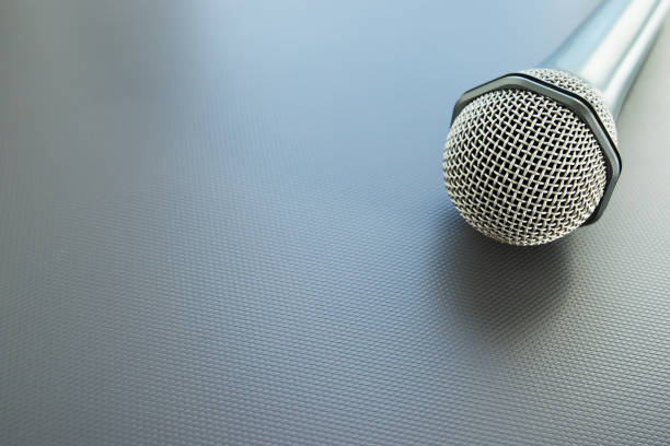 istock microphone keynote,speaker on a blue background with copy space, equipment for lectures, business workshops, meetings 1389286101