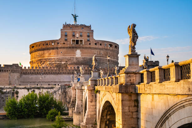 Castel Sant'Angelo mausoleum and Ponte Sant'Angelo bridge over Tiber river in historic city center of Rome in Italy stock photo