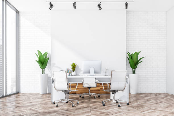 istock Stylish white office with top manager workspace area and panoramic window. 1389286445