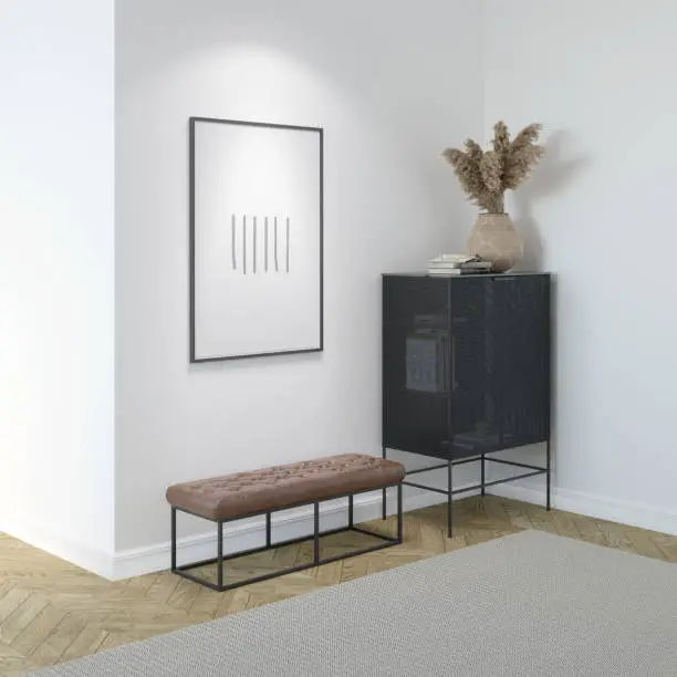 Photo of A modern bright room with an illuminated vertical poster above a leather bench, dried flowers in a wicker vase on a modern black chest of drawers, a light beige carpet on the parquet floor.