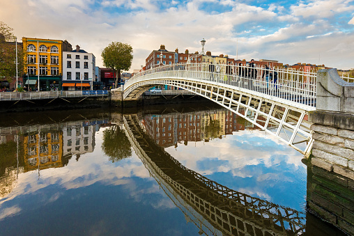 Wide angle view of the Ha'penny Bridge over the River Liffey in Dublin, Ireland, Europe