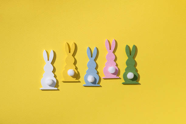 istock Easter holiday concept with many colored rabbit decor 1389294442