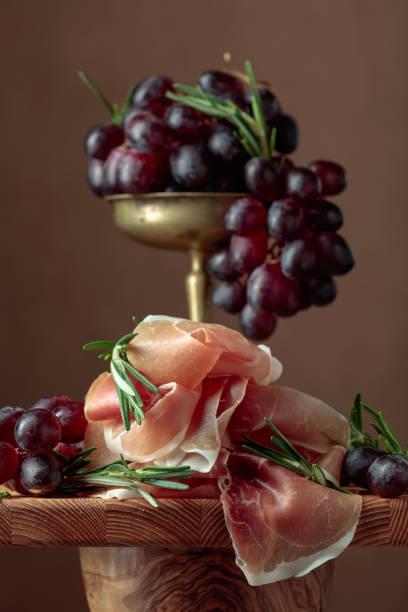 Prosciutto with grapes and rosemary.