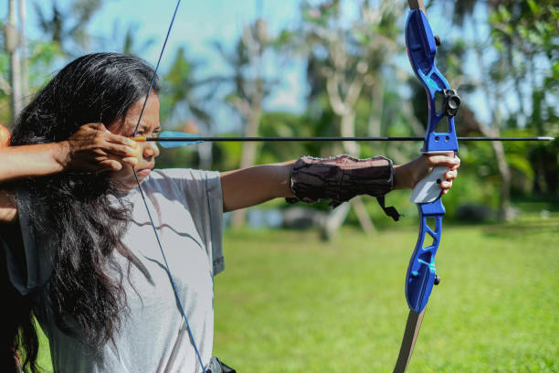 Many arrows hitting the archery target, bulls eye.
