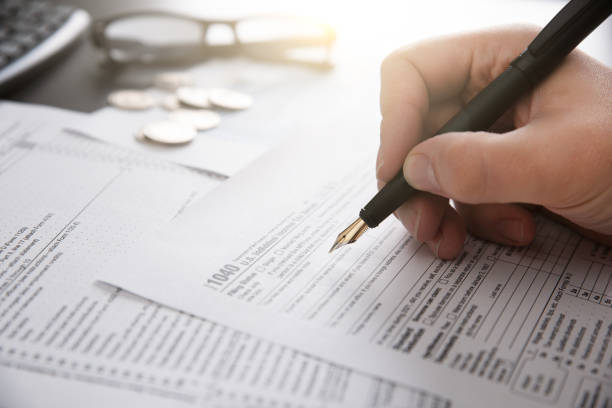 istock Tax return concept wits US 1040 tax form 1389298692