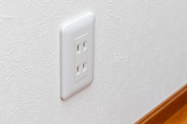 istock Electric outlet mounted on white wall 1389300866