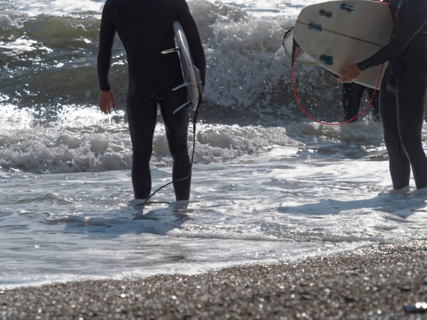 istock a surfer surf a wave in italy 1389301284