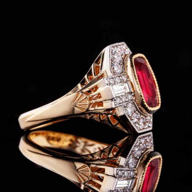 istock Beautiful yellow gold ring with a ruby on a black background 1389302835