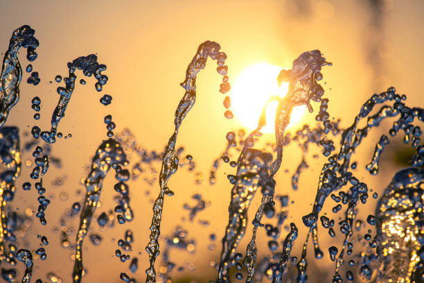 istock drops of the fountain in the setting sun 1389303568