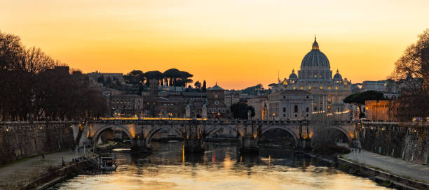 istock St. Angelo Bridge and St. Peter's Basilica at Sunset 1389304166