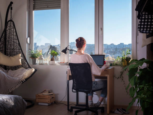istock Woman administrator working alone in workplace in front of computer 1389304187