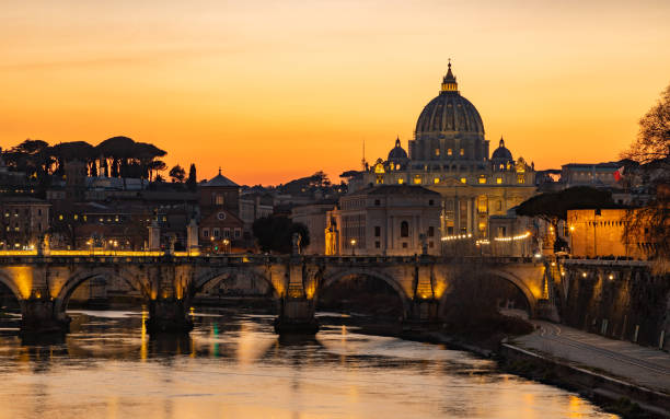 istock St. Angelo Bridge and St. Peter's Basilica at Sunset 1389304200
