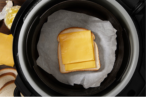 Preparing a Grilled Cheese Sandwich with Processed Cheese Slices and White Bread in the Air Fryer