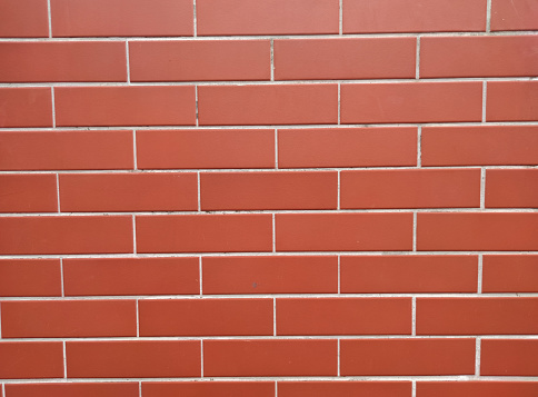 Brick wall with red bricks, red brick background.