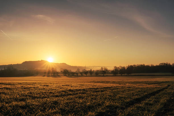 istock sunrise  on a hill in germany 1389307554