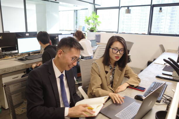 istock Business people work and discuss happily in the office 1389308474