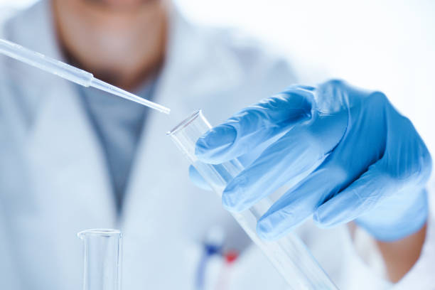 Microbiological research with a test tube and micropipette in close -up stock photo