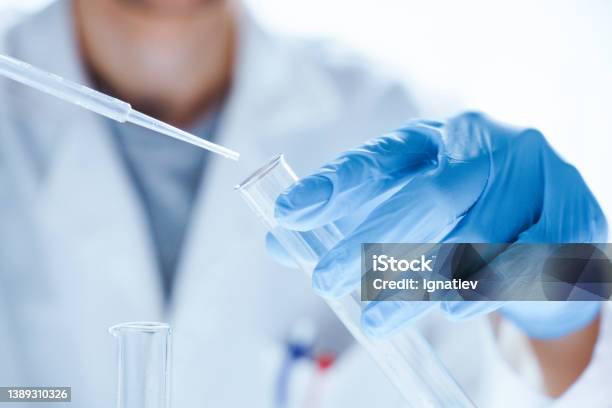 Microbiological Research With A Test Tube And Micropipette In Close Up Stock Photo - Download Image Now