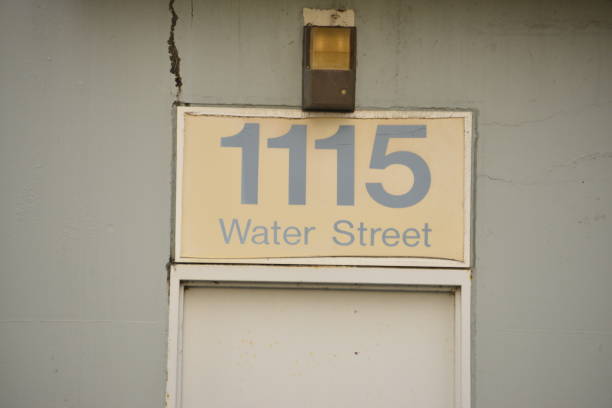 istock Old Street Sign On Building 1389311331