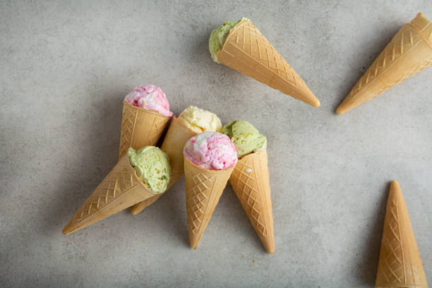 istock ice cream scoops  in waffle green pink vanilla 1389317909