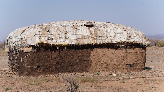 A local village house made of cow dung and cartons.