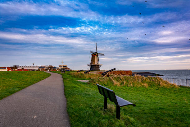 Beautiful view of an old dutch windmill and a perspective