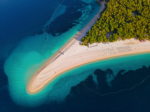 Aerial top down view of Zlatni rat beach on Adriatic sea, Bol, Brac island, Croatia. Summer vacation resort