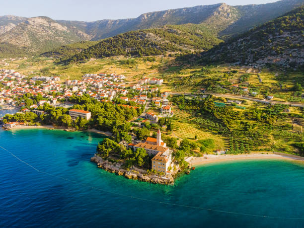 Aerial view of Dominician monastery and Martinica beach on Adriatic sea, Bol, Brac island, Croatia Aerial view of Dominician monastery and Martinica beach on Adriatic sea, Bol, Brac island, Croatia. Summer vacation resort brac island stock pictures, royalty-free photos & images