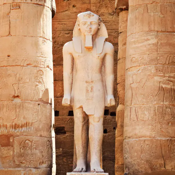 Statue of Rameses II in the Great Court of Rameses II (Peristyle Courtyard) at Luxor Temple in Luxor, Egypt.