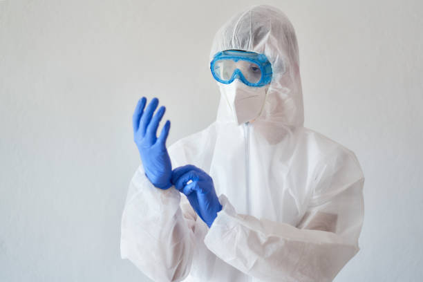 istock Doctor wearing protective wear 1389331979