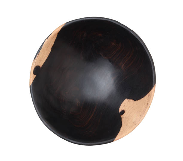 istock Wood ebony bowl isolated on white. 1389333824