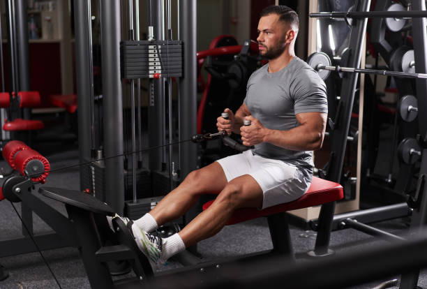 istock Athletic man doing back workout in the gym 1389333842