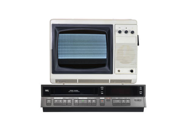 istock Old TV with noise and interference on the screen and VCR isolated on white background. 1389335718
