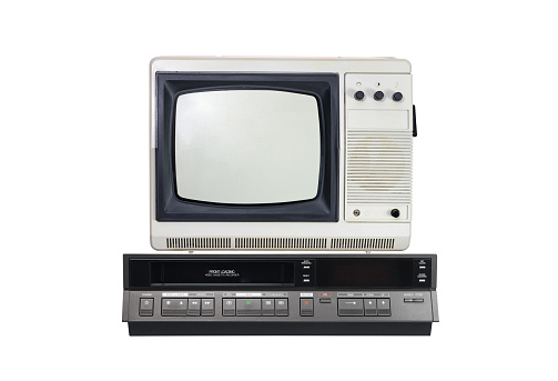 Old TV and VCR isolated on white background.