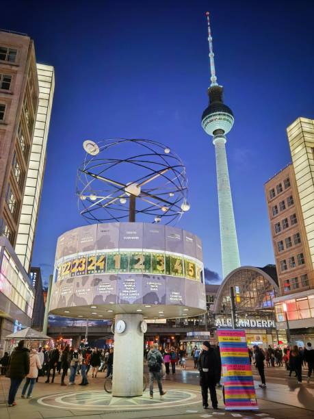alexanderplatz, world clock and fernsehturm tower, berlin - clock station people berlin germany imagens e fotografias de stock