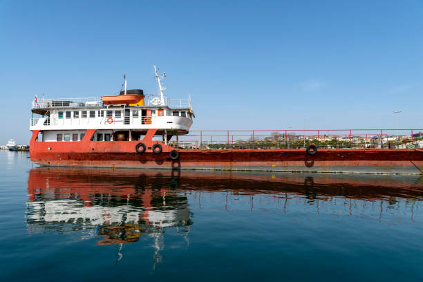 istock An old freighter docked in the harbor, standing by. 1389340963