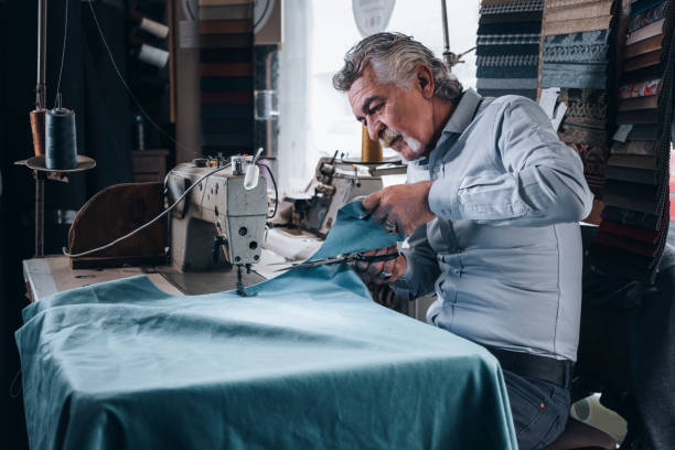 istock Senior tailor man working in small business 1389341865