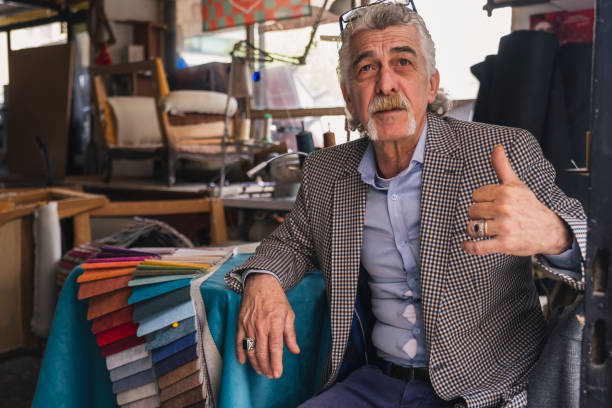 istock Senior tailor man working in small business 1389341874