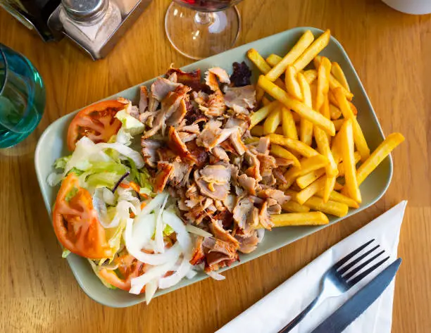 Photo of Dish Doner kebab with French fries and a light vegetable salad