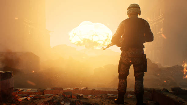 soldier against a nuclear explosion - mushroom cloud imagens e fotografias de stock