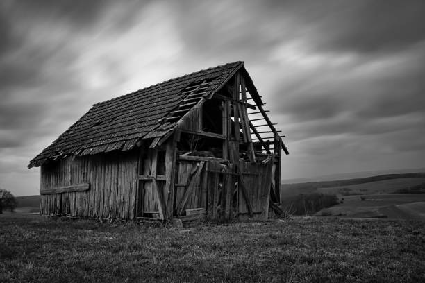 istock old spooky abandoned barn with clouds in the background 1389345749