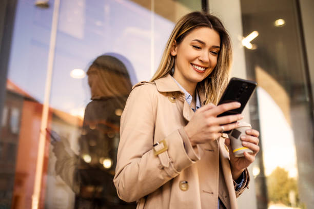 istock Business woman text messaging 1389345909