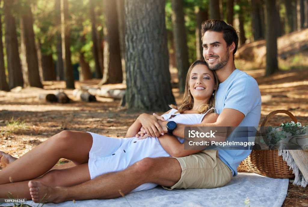 Shot of a young couple having a picnic in the forest I love it when it's just us 20-24 Years Stock Photo